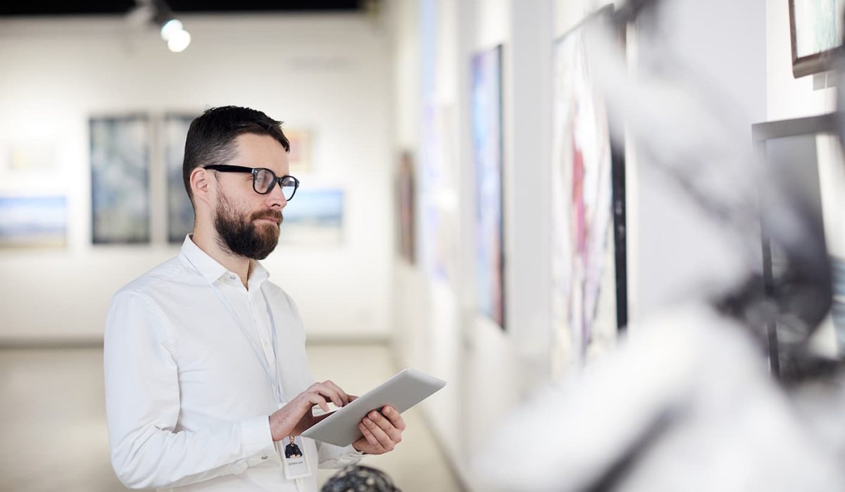 bearded-man-managing-modern-art-gallery-BFUXKGW.jpg
